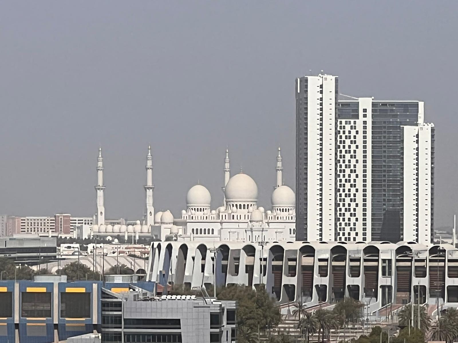 ADIBF 2022, skyline of Abu Dhabi with Great Mosque in the background